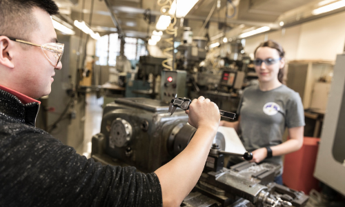 Two students at the machine shop