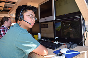 Professor Lum and student monitoring UAV on monitors