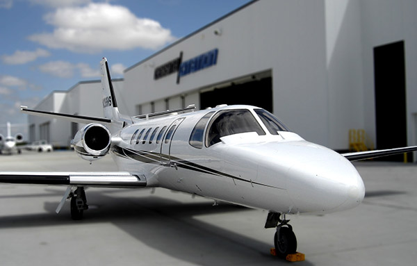 an airplane outside a hangar