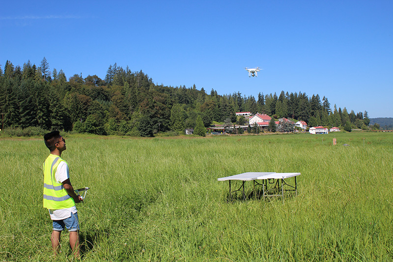 A student launching a drone