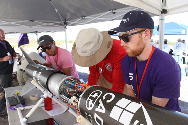 students working on the rocket