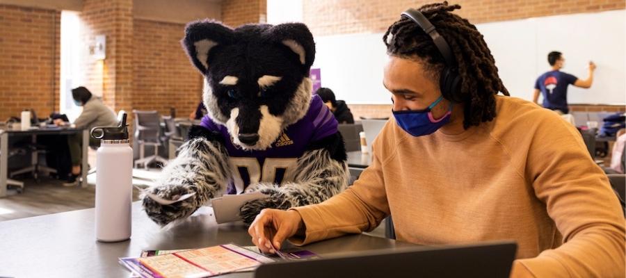 Student with UW mascot