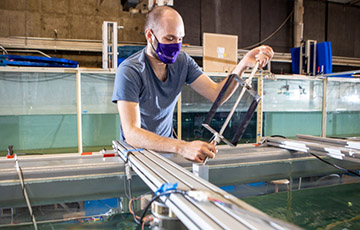 Aidan Hunt inspects a marine energy turbine