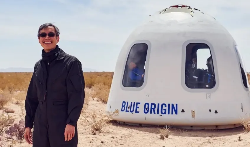 Gary Lai with the New Shepard capsule