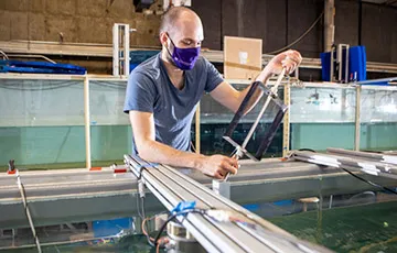 Aidan Hunt inspects a marine energy turbine