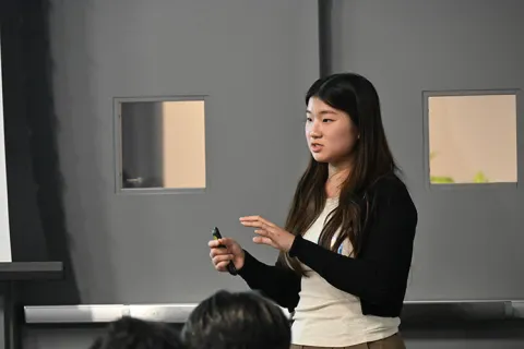Person presenting in front of a group