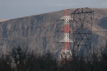 Power line towers against a mountain background in Chelan County