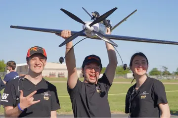 Three students with the Mako model plane.